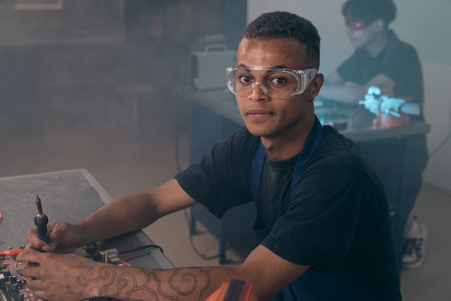 A man wearing safety glasses