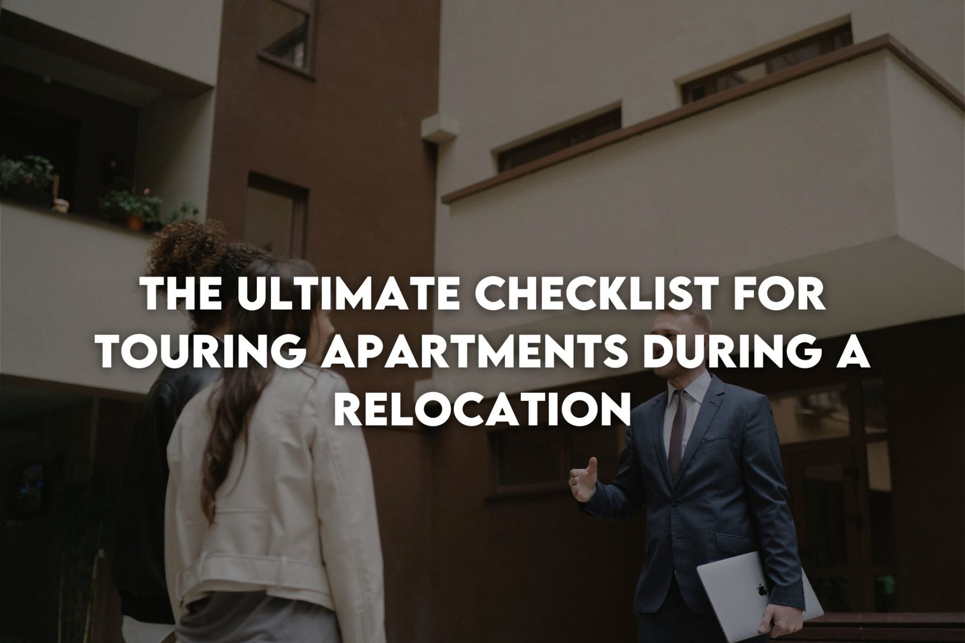 A man in a suit greeting a couple