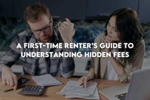 Couple looking at bills next to laptop and calculator